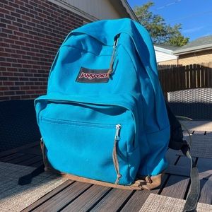 Blue Jansport Backpack with Brown Suede